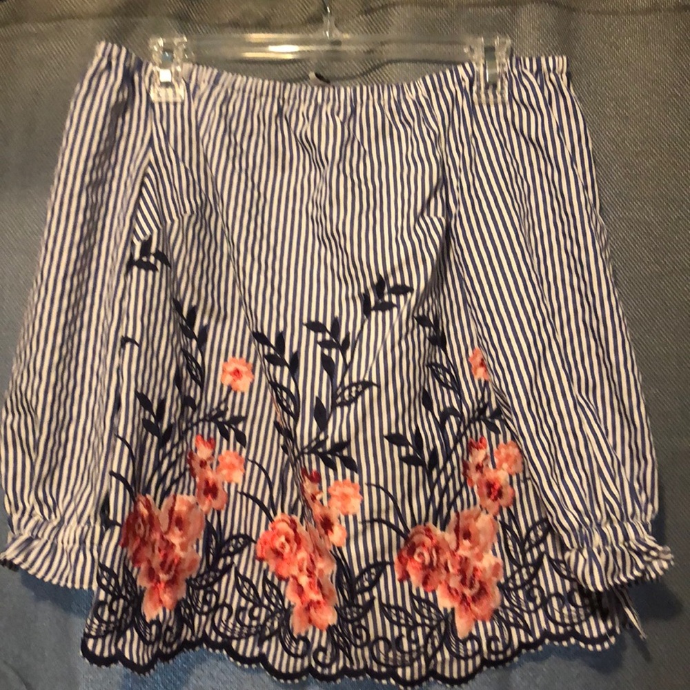 Adorable off the shoulder shirt.
